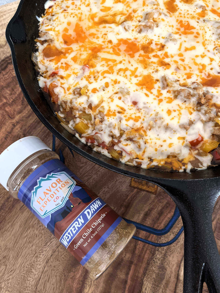 Saddle Up! Stuffed Pepper Casserole in a skillet with Western Dawn seasoning sprinkled on top.