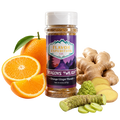Jar of 'Dragon's Twilight' seasoning with oranges, ginger, and wasabi on a white background