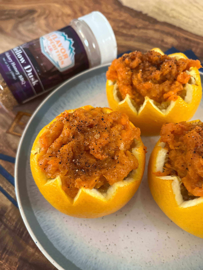 Smoky Sweet Potato in Citrus Cups topped with Mellow Dusk seasoning on a plate, showcasing a delicious recipe.