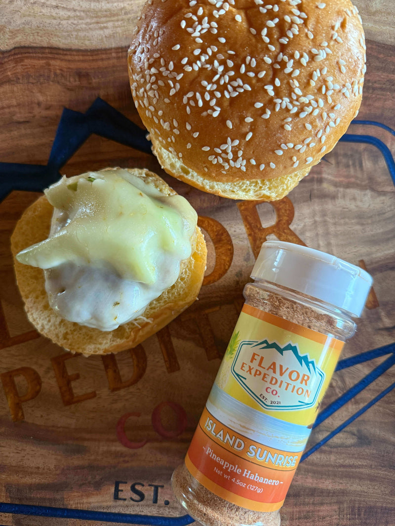 Tropic Like It’s Hot Avocado Turkey Burgers with Island Sunrise seasoning and sesame seed buns.