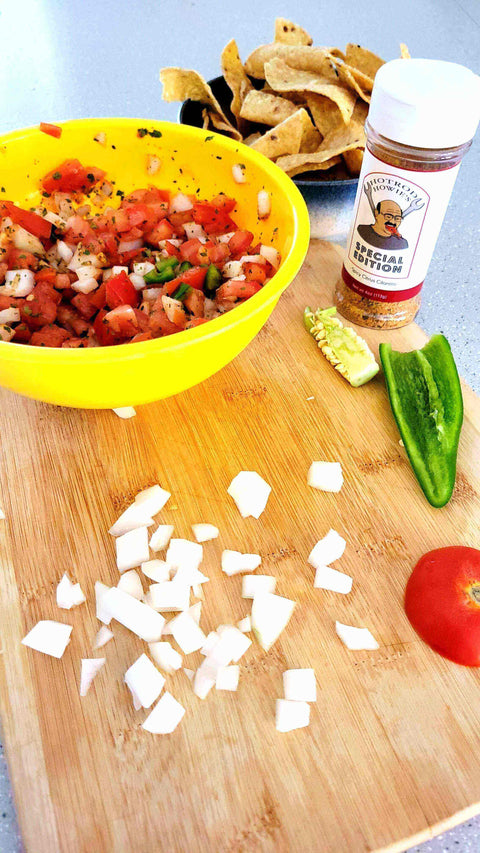 Fresh ingredients for Howie’s No-Brakes Pico de Gallo, including diced veggies and tortilla chips.
