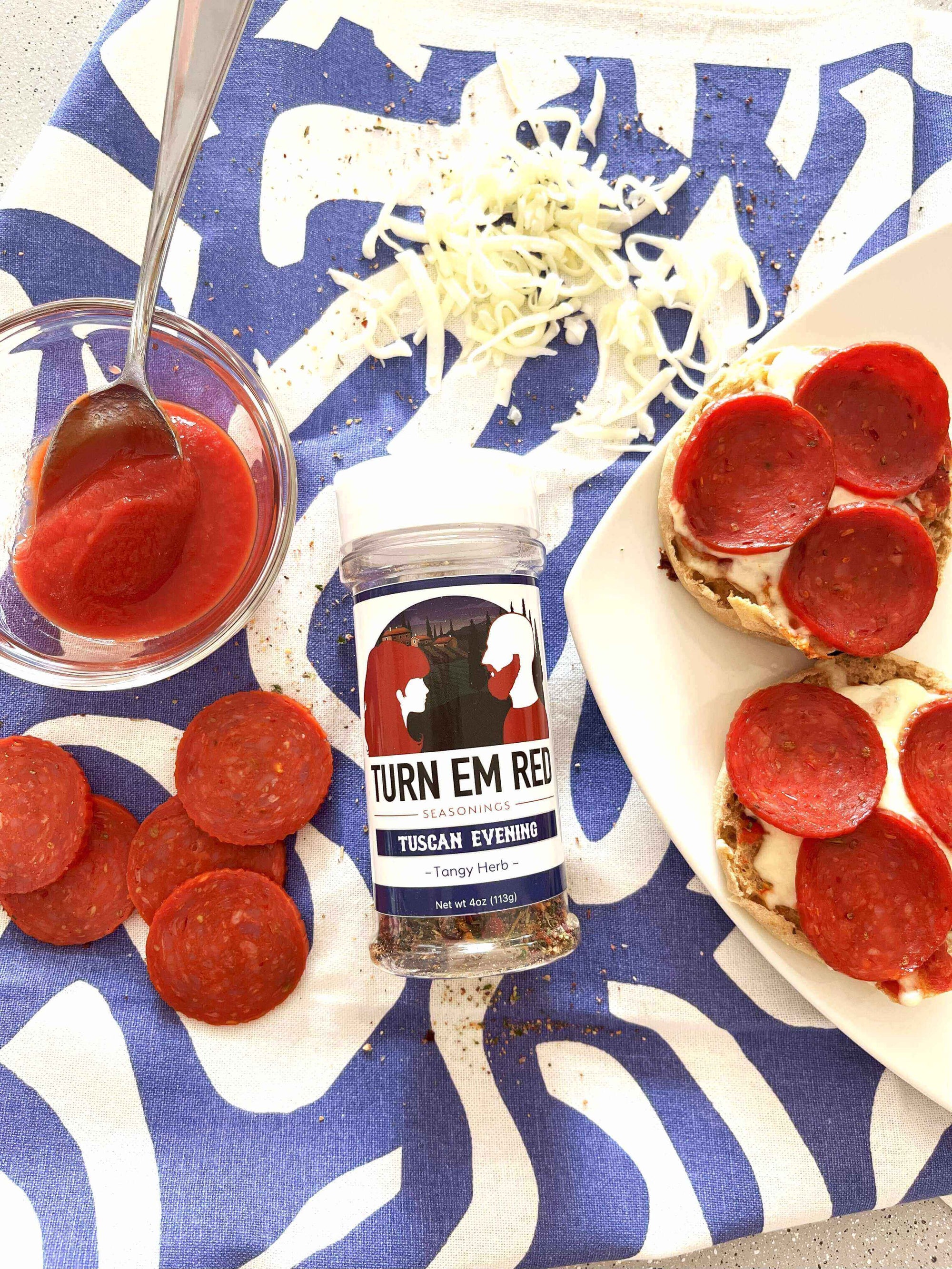 Mini Pizzas, Big Flavor: Quick English Muffin Pizzas topped with pepperoni and seasoning.