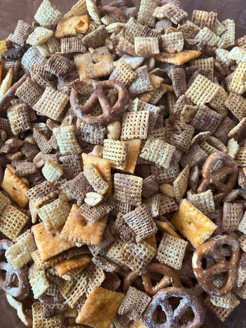 Snack Attack Supreme: Rosemary Red Pepper Parm Party Mix featuring a crunchy blend of pretzels, cereal, and crackers.