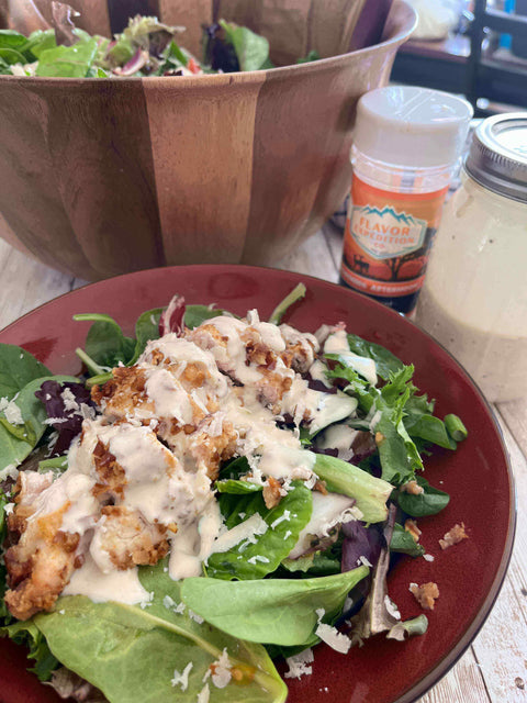 Delicious Spicy Mustard Pretzel Chicken Salad topped with creamy dressing and served in a vibrant bowl.