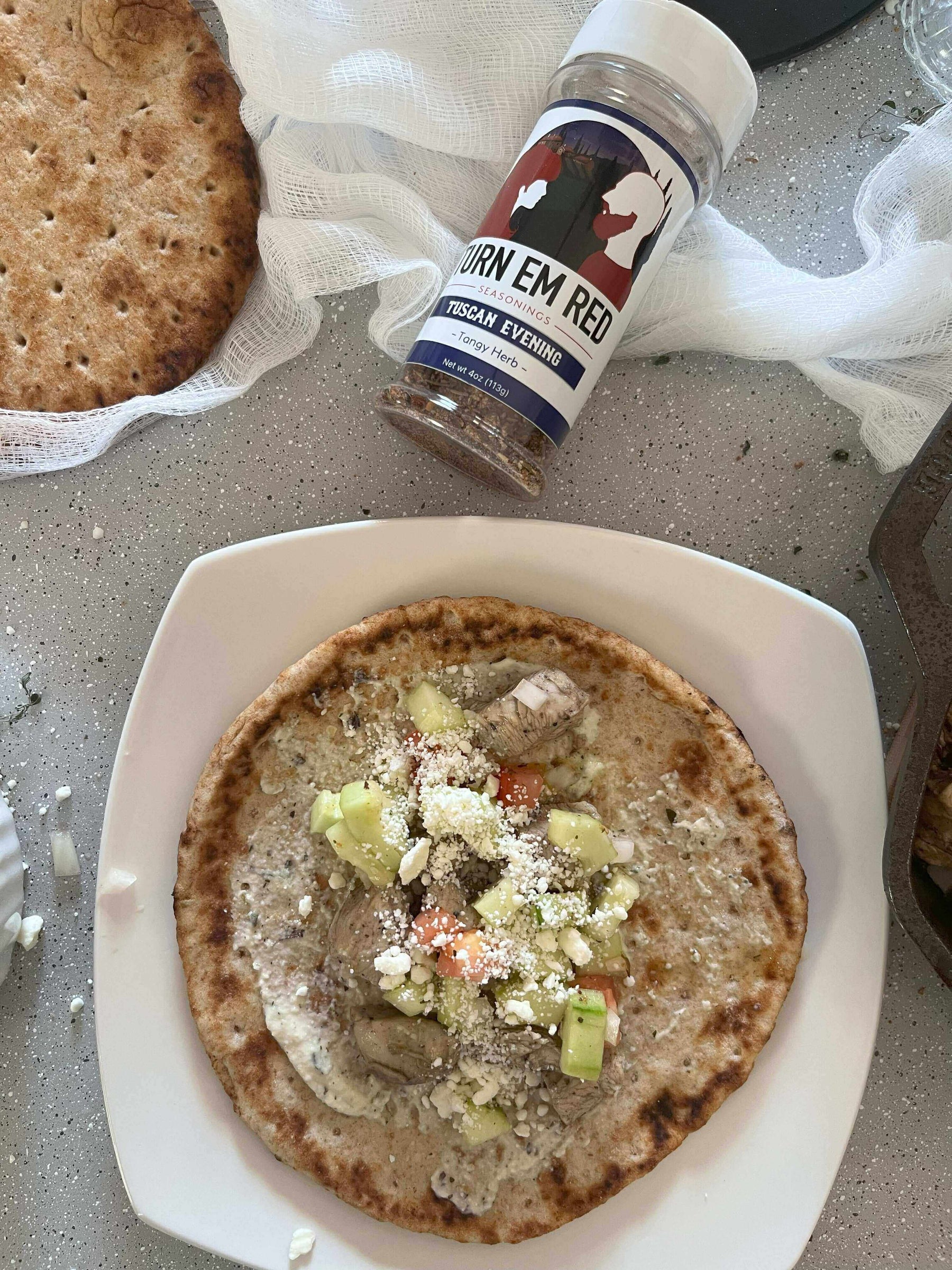 Chicken-Cucumber Gyros: A No-Oven Summer Delight served on a pita with fresh cucumber and seasoning.
