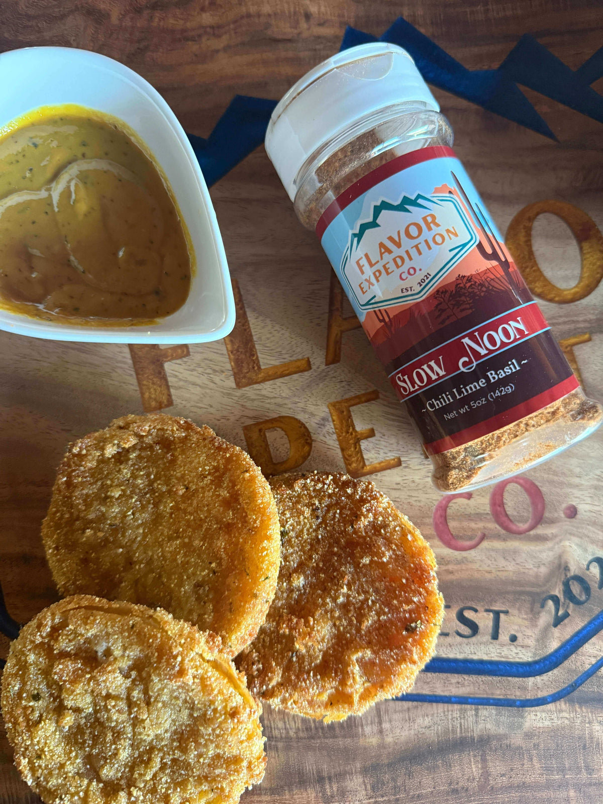 Southern Sass on a Plate: Fried Green Tomatoes with Slow Noon Seasoning and a side of dipping sauce.