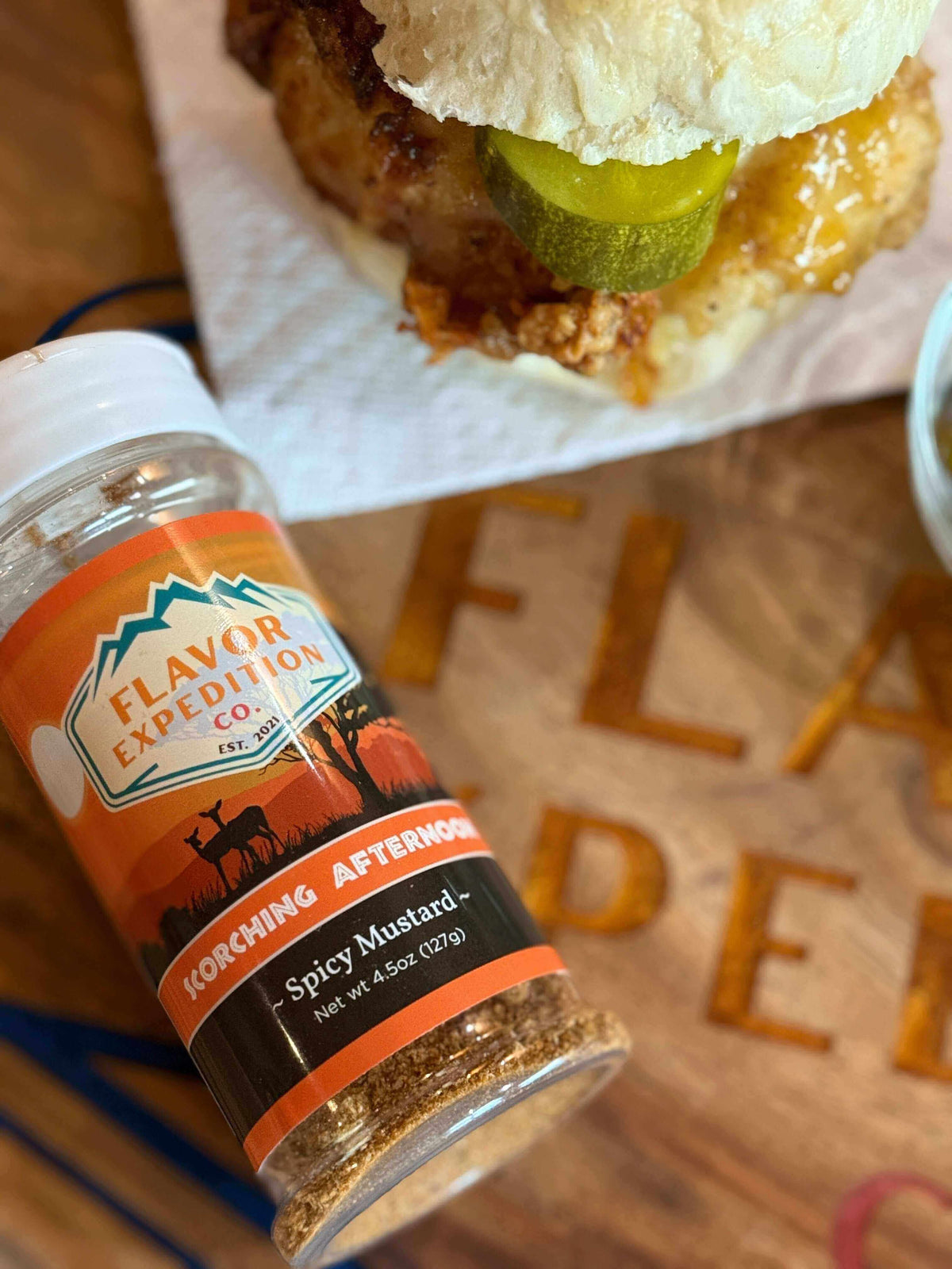 Nashville Hot Chicken Sandwich with Flavor Expedition Co. Korching Afternoon seasoning bottle in focus.