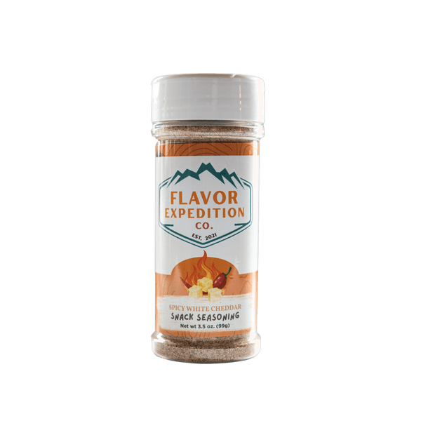 Spicy White Cheddar Seasoning bottle from Flavor Expedition Co. for flavorful snacks and popcorn.