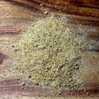Dry herb powder on a wooden surface
