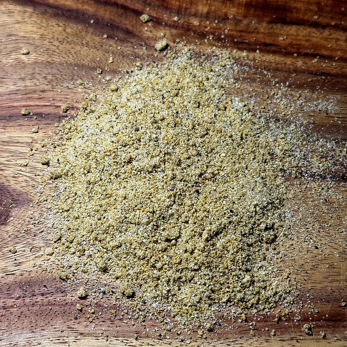 Apple Jalapeno Seasoning spread on a wooden surface, showcasing its unique blend of flavors.