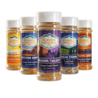 Collection of Flavor Expedition Co. spice jars with various labels on a black background