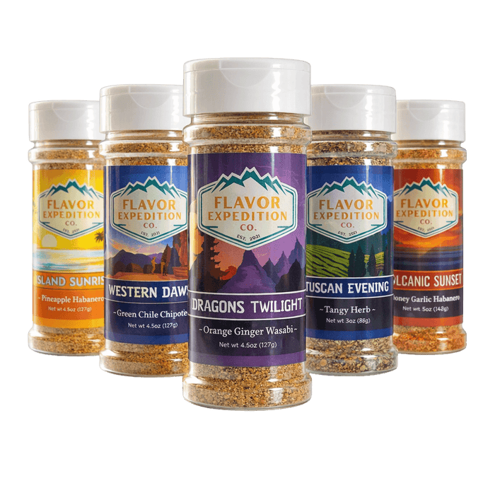Collection of Flavor Expedition Co. spice jars with various labels on a black background