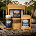 Flavor Expedition Mellow Dusk Hickory Honey BBQ seasoning packages on a wooden surface with a natural background.