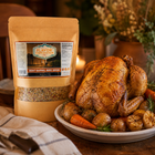 Roasted chicken with carrots and potatoes on a plate next to a package of 'Flavor Expedition' brine.
