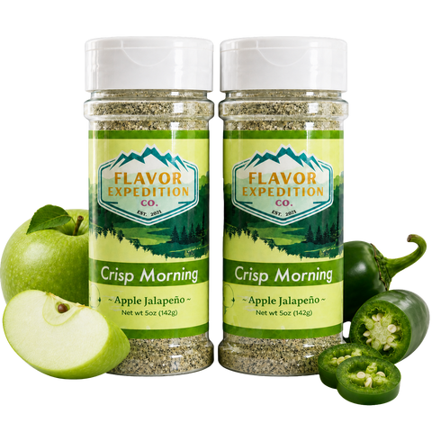 Two bottles of 'Crisp Morning' Apple Jalapeño seasoning from Flavor Expedition Co. with apples and jalapeños on a white background.