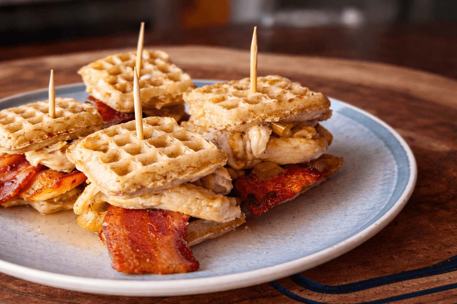 Waffle sandwich with bacon and chicken on a plate