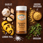 Cajun Blackened seasoning with garlic, lemon peel, ground mustard, and oregano on a wooden background.