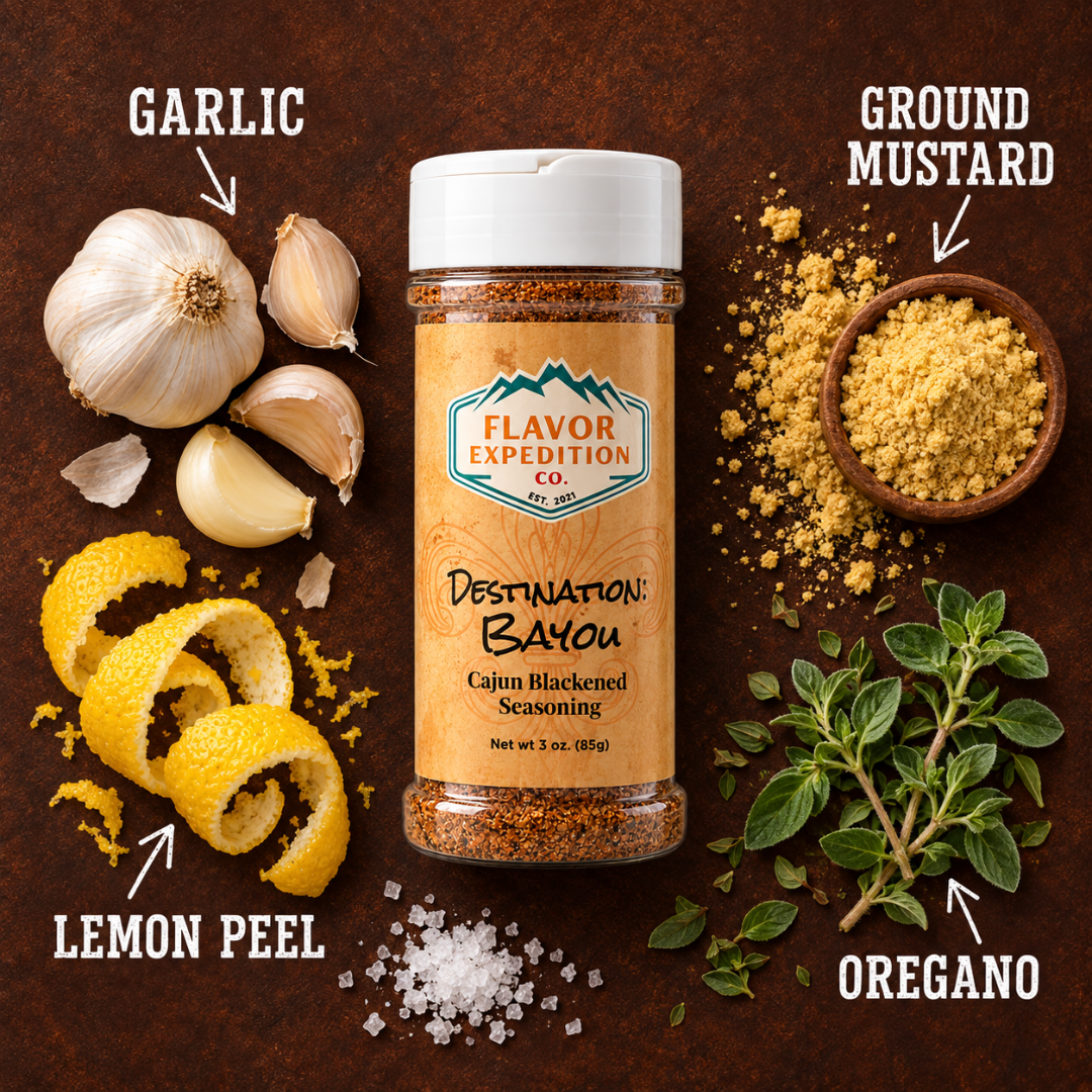 Cajun Blackened seasoning with garlic, lemon peel, ground mustard, and oregano on a wooden background.