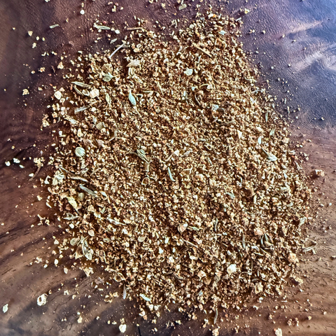 Cajun Blackened seasoning seasoning blend on wooden surface, perfect for enhancing seafood, chicken, and beef dishes.