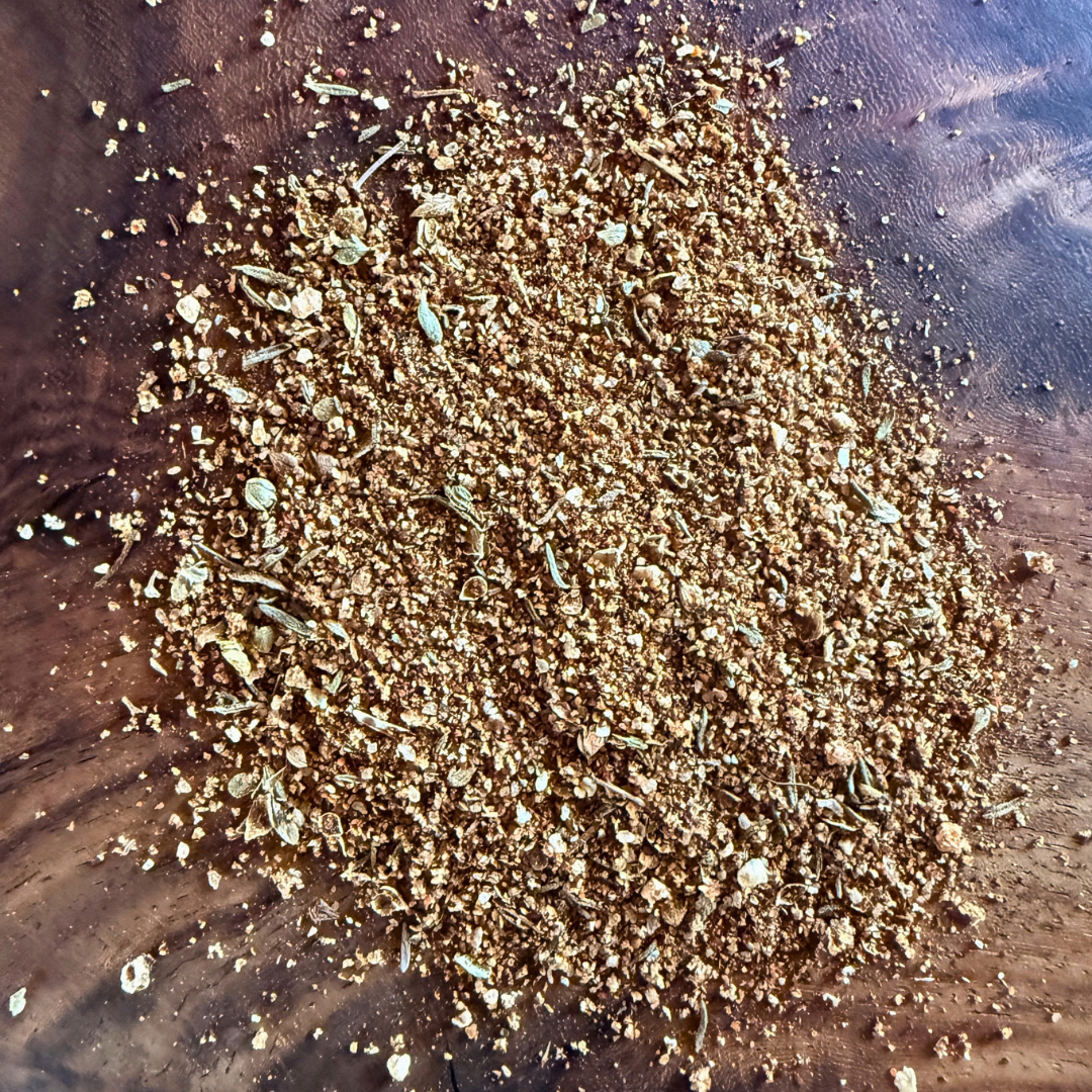 Cajun Blackened seasoning seasoning blend on wooden surface, perfect for enhancing seafood, chicken, and beef dishes.