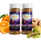 Two jars of 'Dragon's Twilight' seasoning from Flavor Expedition Co. with oranges, ginger, and wasabi on a white background.