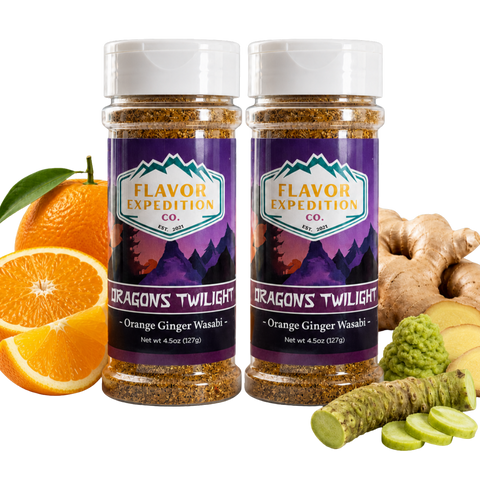 Two jars of 'Dragon's Twilight' seasoning from Flavor Expedition Co. with oranges, ginger, and wasabi on a white background.
