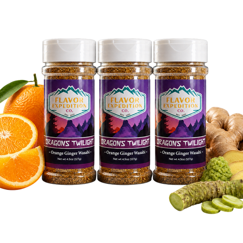 Three bottles of Flavor Expedition Co. 'Dragon's Twilight' seasoning with oranges, ginger, and wasabi on a white background.