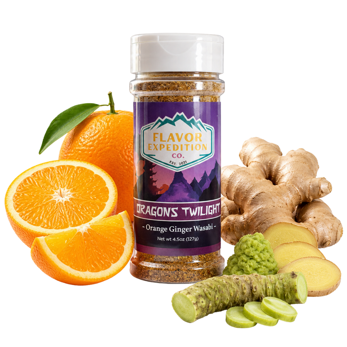 Jar of 'Dragon's Twilight' seasoning with oranges, ginger, and wasabi on a white background