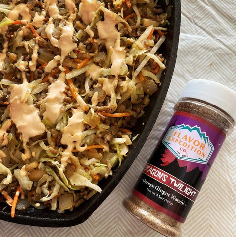 A delicious stir-fry topped with creamy sauce, alongside Flavor Expedition's Dragon's Twilight Ginger Wasabi seasoning.