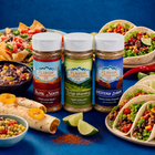 Three bottles of Flavor Expedition Co. seasoning with Mexican food on a blue background