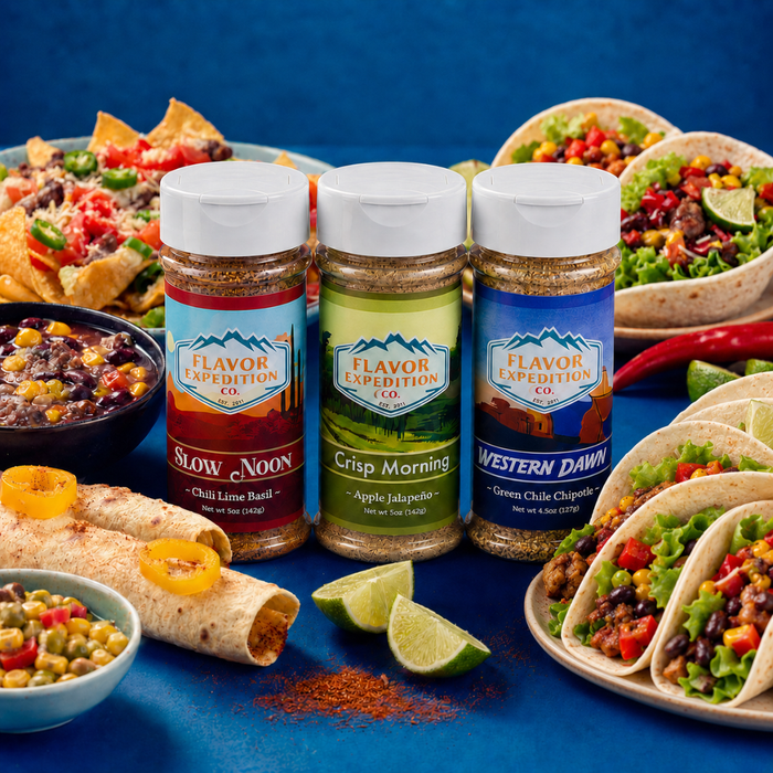 Three bottles of Flavor Expedition Co. seasoning with Mexican food on a blue background