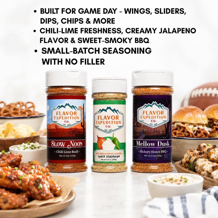 Three Flavor Expedition Co. seasoning bottles displayed on a white surface with food props around them and marketing text at the top.