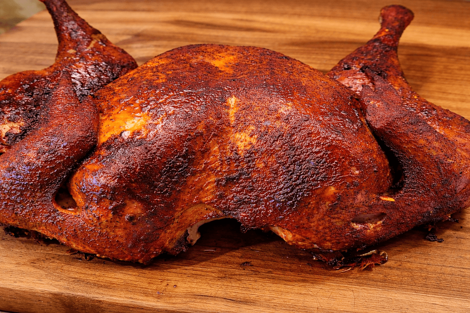 Smoked chicken on a wooden cutting board