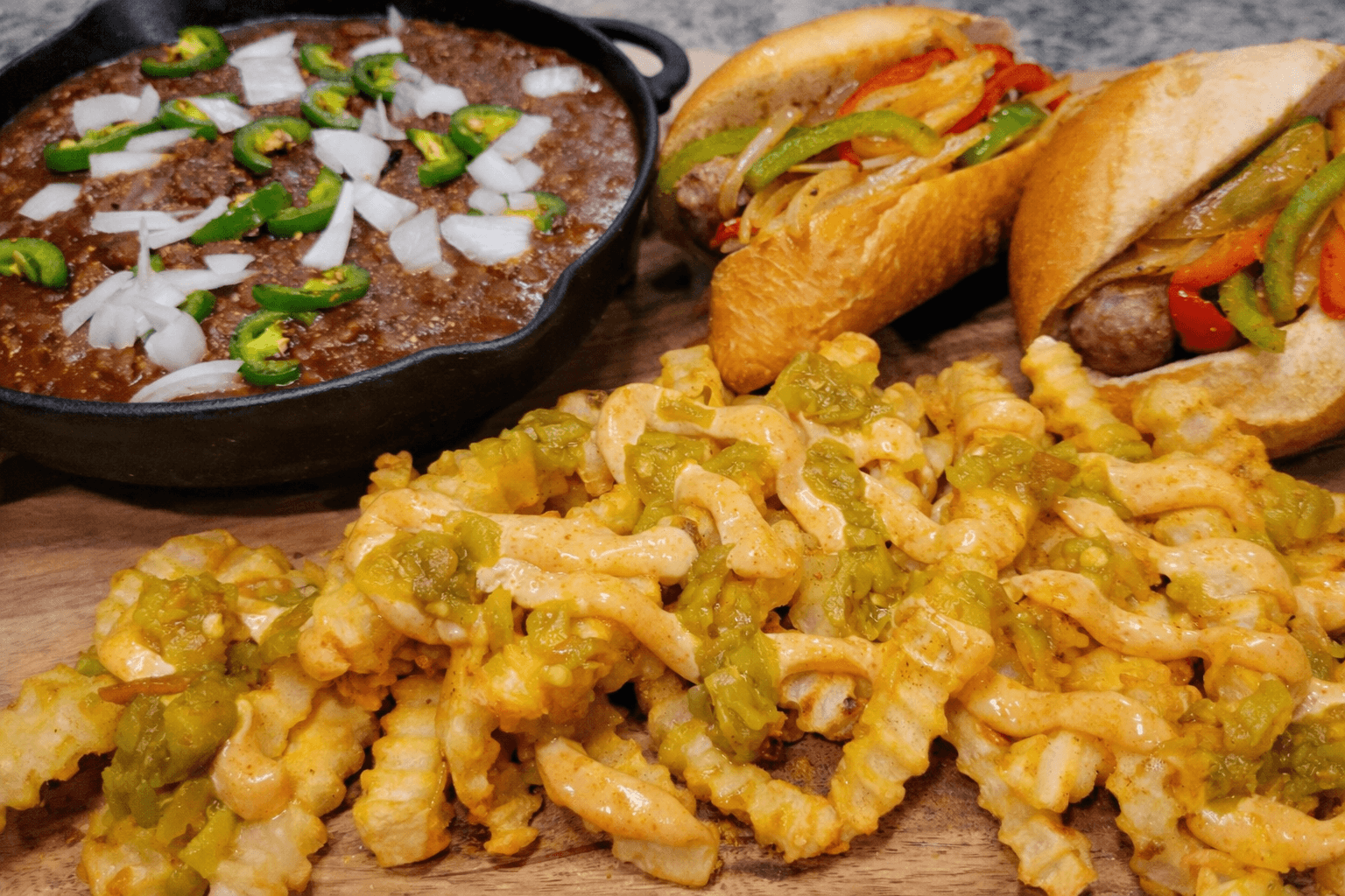 Dish with pasta, skewer, and side dish on a wooden board