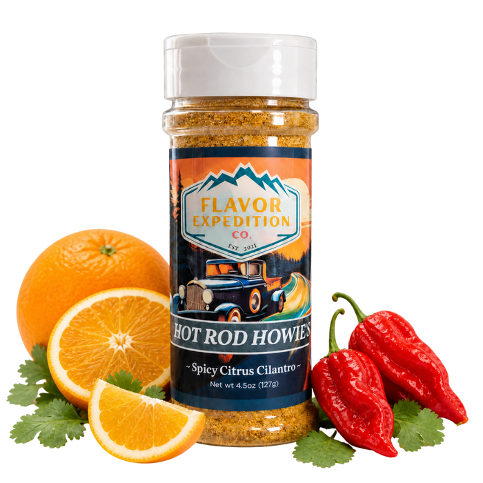 Spice jar labeled 'Hot Rod Howies' with oranges and peppers on a white background