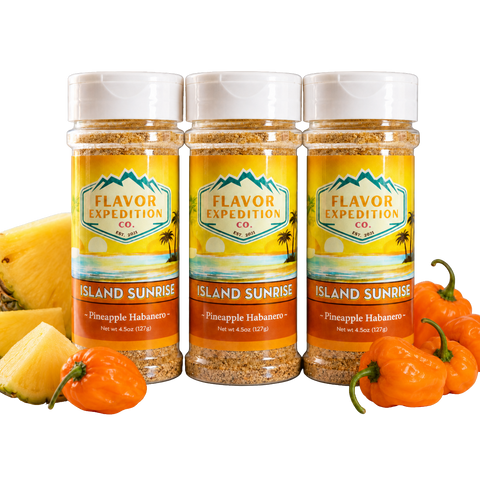 Three jars of 'Island Sunrise' seasoning from Flavor Expedition Co. with pineapples and habanero peppers on a white background.