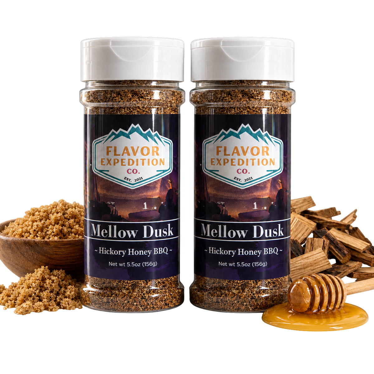 Two jars of 'Mellow Dusk' Hickory Honey BBQ seasoning from Flavor Expedition Co. with ingredients around on a white background. [pack-2]