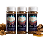 Three bottles of Flavor Expedition Co. Mellow Dusk Hickory Honey BBQ seasoning with ingredients on a white background.
