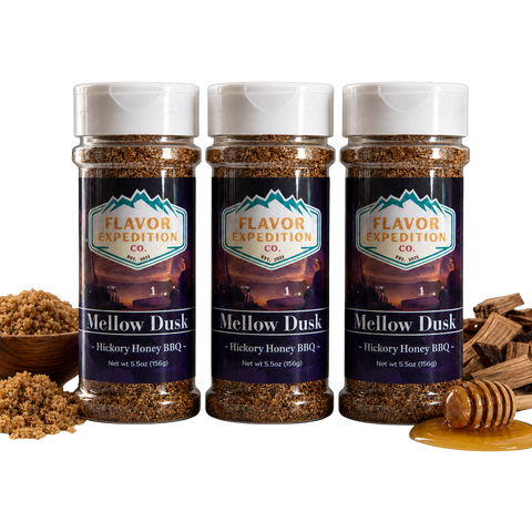 Three bottles of Flavor Expedition Co. Mellow Dusk Hickory Honey BBQ seasoning with ingredients on a white background.