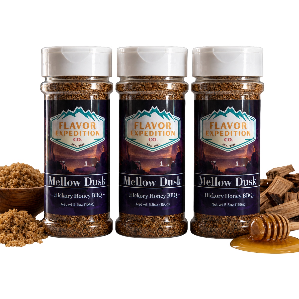 Three bottles of Flavor Expedition Co. Mellow Dusk Hickory Honey BBQ seasoning with ingredients on a white background. [pack-3]