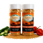 Two jars of 'Scorching Afternoon' spicy mustard from Flavor Expedition Co. with peppers and mustard seeds on a white background.