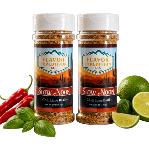 Two jars of Flavor Expedition Co. Slow Noon Chili Lime Basil seasoning with chili peppers, lime, and basil on a white background.