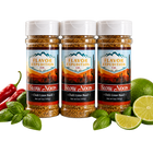 Three jars of 'Slow Noon' Chili Lime Basil seasoning with chili peppers, lime, and basil on a white background.