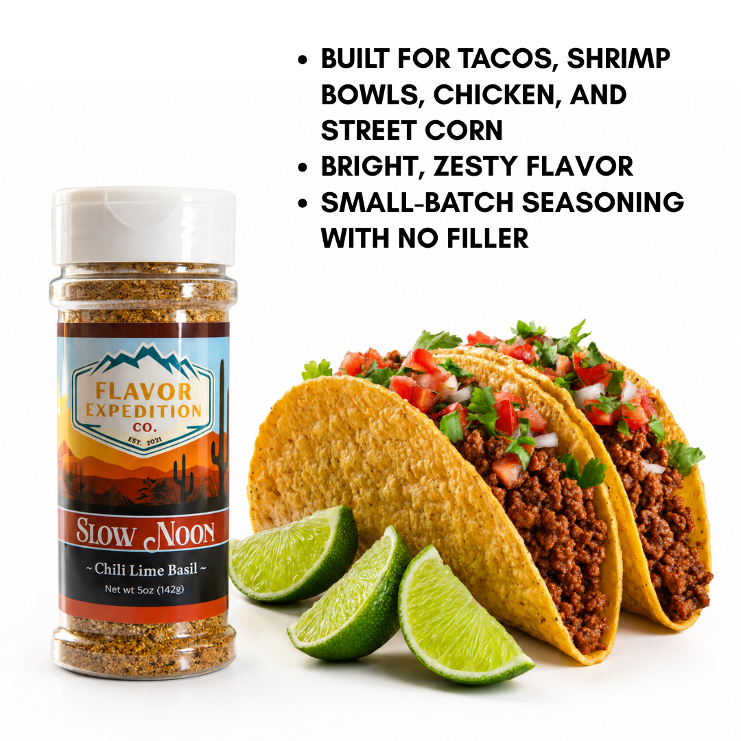 Chili Lime Basil Seasoning in bottle beside tacos and lime, ideal for enhancing flavors in various dishes.