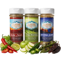 Three jars of Flavor Expedition Co. spices with ingredients like peppers and apples on a white background