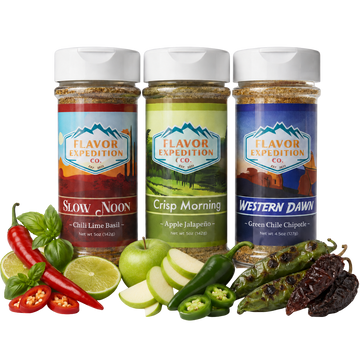 Three jars of Flavor Expedition Co. spices with ingredients like peppers and apples on a white background