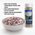 Bowl of salad with a bottle of Flavor Expedition Tuscan Evening seasoning on a white background