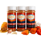 Three bottles of Flavor Expedition Co. Volcanic Sunset seasoning with peppers, garlic, and honey on a white background.