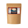 Kraft paper packaging with a label for 'Flavor Expedition Volcanic Sunset' on a white background