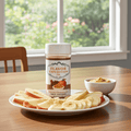 Flavor Expedition Co. seasoning jar on a table with fruit and dip.